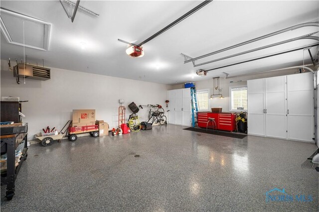 1860 Watermill Ln, Perrysburg, OH 43551 - garage featuring a garage door opener