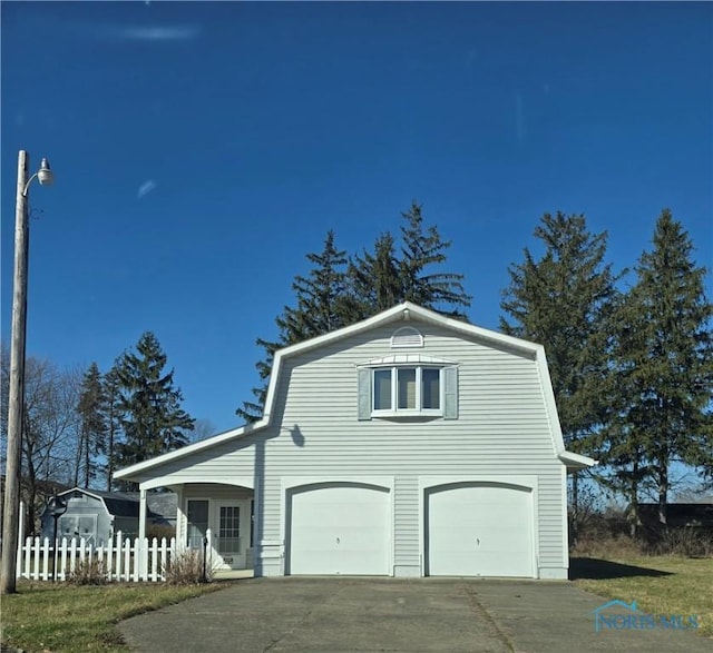 555 Race St, Clyde, OH 43410 - view of side of property with an attached garage and concrete driveway