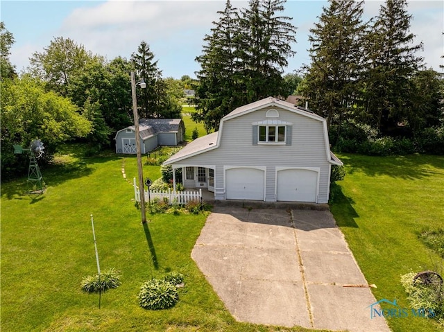 555 Race St, Clyde, OH 43410 - view of front of house with a front lawn, concrete driveway, an attached garage, and view of scattered trees
