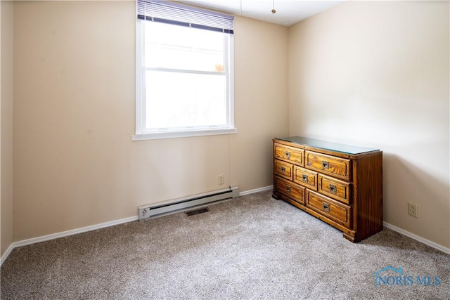 555 Race St, Clyde, OH 43410 - bedroom featuring a baseboard radiator, carpet flooring, and baseboards