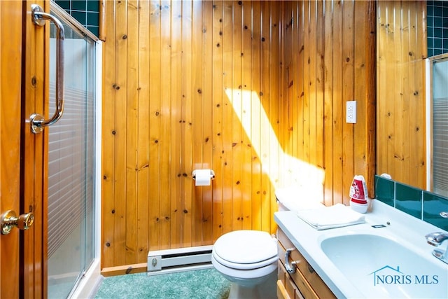 555 Race St, Clyde, OH 43410 - bathroom featuring a baseboard heating unit, a stall shower, wood walls, toilet, and vanity