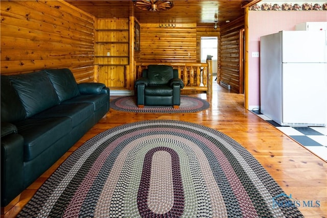 555 Race St, Clyde, OH 43410 - living room with wood finished floors, wooden ceiling, and wood walls