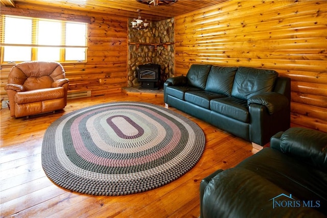 555 Race St, Clyde, OH 43410 - living area with hardwood / wood-style flooring, rustic walls, a wood stove, and wood ceiling