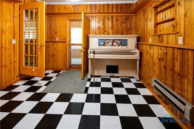 555 Race St, Clyde, OH 43410 - miscellaneous room featuring a baseboard radiator, wooden walls, and tile patterned floors