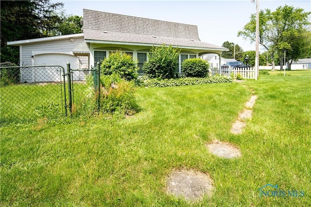 555 Race St, Clyde, OH 43410 - view of yard with a garage