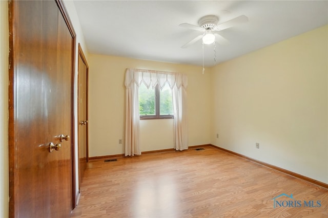 4820 Olde Meadow Ln, Sylvania, OH 43560 - unfurnished bedroom with light wood-type flooring, baseboards, and a ceiling fan