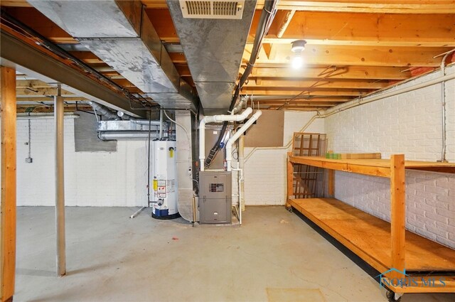 4820 Olde Meadow Ln, Sylvania, OH 43560 - unfinished below grade area with water heater, heating unit, and brick wall