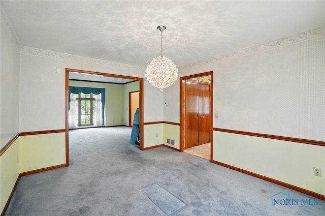 4820 Olde Meadow Ln, Sylvania, OH 43560 - carpeted empty room with a chandelier, baseboards, ornamental molding, and wallpapered walls