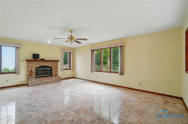 4820 Olde Meadow Ln, Sylvania, OH 43560 - unfurnished living room with a ceiling fan, baseboards, and a brick fireplace