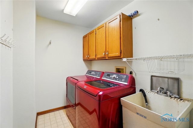 4820 Olde Meadow Ln, Sylvania, OH 43560 - washroom featuring separate washer and dryer, light flooring, cabinet space, and baseboards