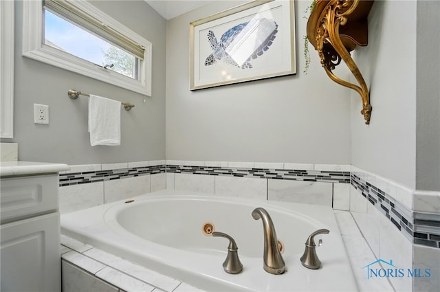 8420 Willow Glen Ct, Holland, OH 43528 - bathroom with a jetted tub and vanity