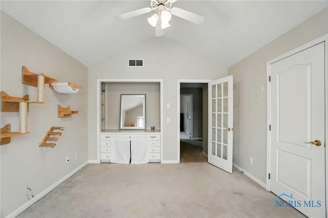 8420 Willow Glen Ct, Holland, OH 43528 - unfurnished bedroom featuring light carpet, baseboards, vaulted ceiling, french doors, and ceiling fan
