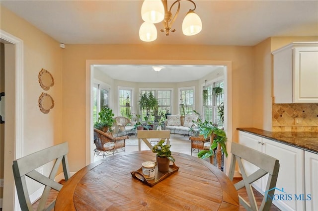 8420 Willow Glen Ct, Holland, OH 43528 - dining space featuring a chandelier and ceiling fan