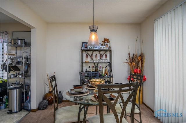 1711 Brownstone Blvd, Toledo, OH 43614 - dining room with carpet, baseboards, and plenty of natural light