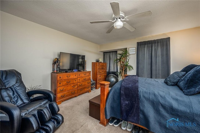 1711 Brownstone Blvd, Toledo, OH 43614 - bedroom with carpet floors, a ceiling fan, and a textured ceiling