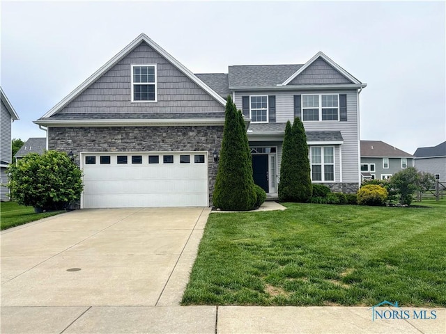 3244 Chasenwood Way, Perrysburg, OH 43551 - view of front of property featuring stone siding, a front yard, driveway, and a garage