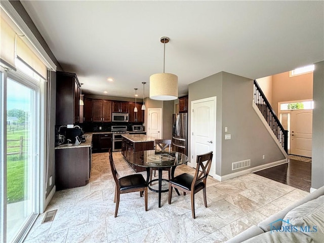 3244 Chasenwood Way, Perrysburg, OH 43551 - dining room with baseboards, light stone finish flooring, recessed lighting, and stairs