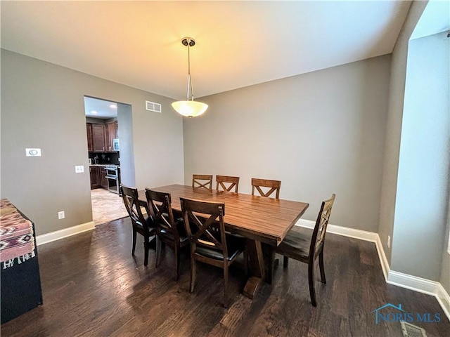3244 Chasenwood Way, Perrysburg, OH 43551 - dining space with dark wood finished floors and baseboards