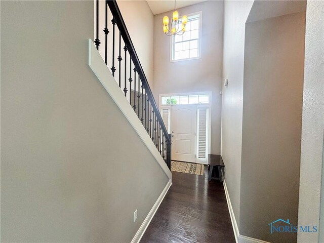 3244 Chasenwood Way, Perrysburg, OH 43551 - entryway with a chandelier, baseboards, wood finished floors, stairway, and a high ceiling