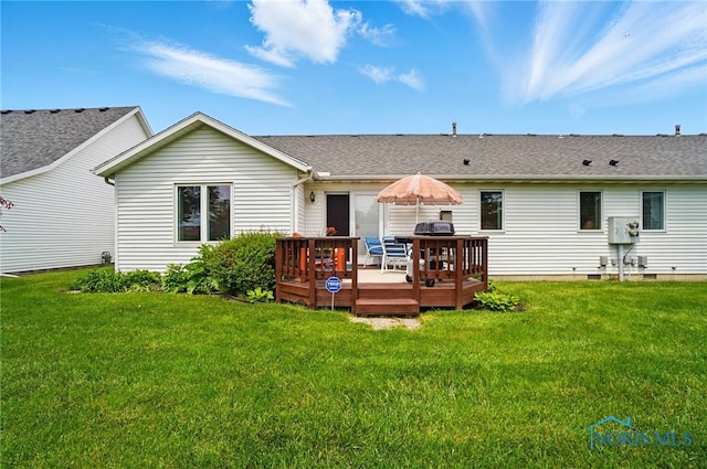 5733 Brook Cliffe Rd, Toledo, OH 43614 - rear view of house with a deck, a lawn, and roof with shingles