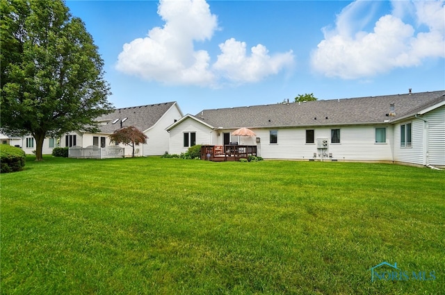 5733 Brook Cliffe Rd, Toledo, OH 43614 - back of house featuring a wooden deck and a yard