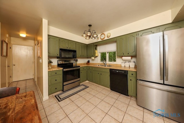 633 Hillcrest Ave, Findlay, OH 45840 - kitchen with green cabinetry, black appliances, a sink, and light countertops
