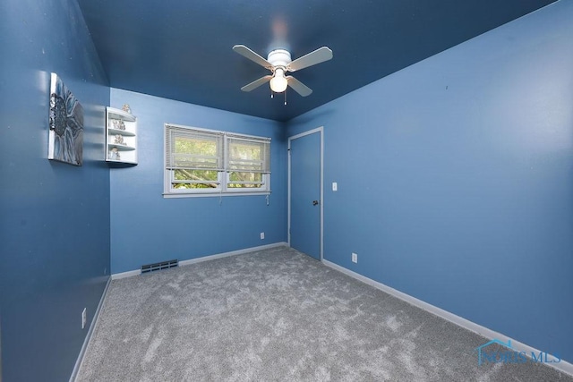 633 Hillcrest Ave, Findlay, OH 45840 - spare room with a ceiling fan, carpet floors, and baseboards