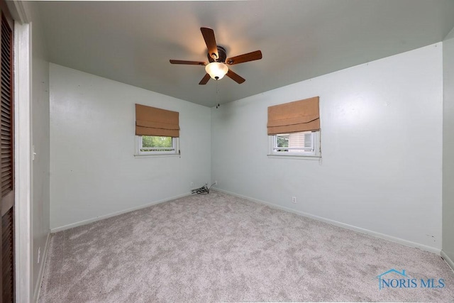 633 Hillcrest Ave, Findlay, OH 45840 - spare room featuring a ceiling fan, healthy amount of natural light, carpet floors, and baseboards