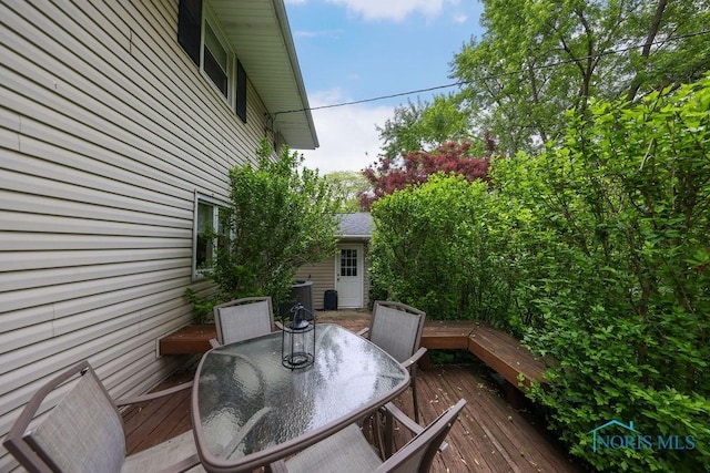 633 Hillcrest Ave, Findlay, OH 45840 - wooden terrace with outdoor dining area and central AC