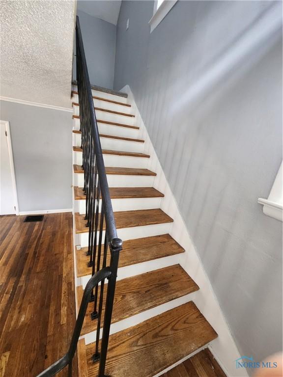815 S Blanchard St, Findlay, OH 45840 - staircase with wood-type flooring