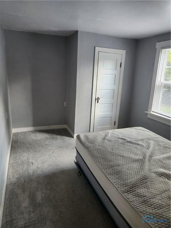 815 S Blanchard St, Findlay, OH 45840 - carpeted bedroom featuring baseboards