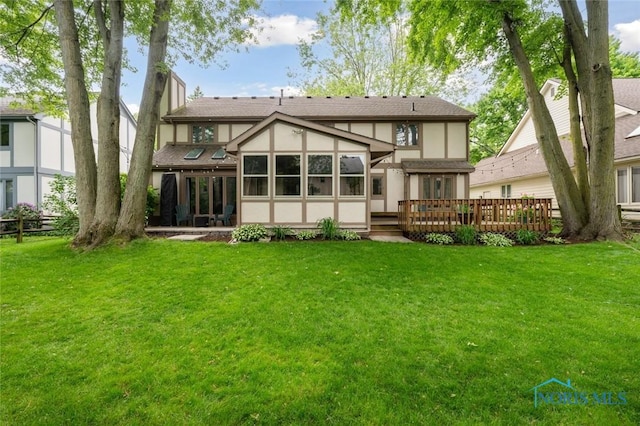 2426 Gibley Park Rd, Toledo, OH 43617 - back of house with stucco siding, a lawn, and a wooden deck