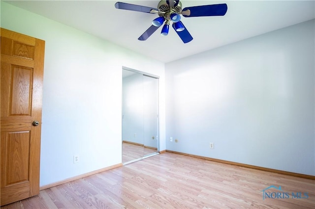 1621 Acorn Dr, Toledo, OH 43615 - unfurnished bedroom with light wood finished floors, a closet, and ceiling fan