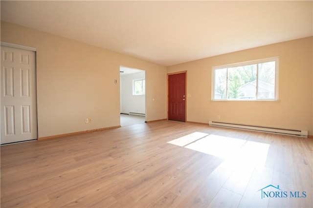 1621 Acorn Dr, Toledo, OH 43615 - unfurnished room featuring a baseboard radiator and light wood-type flooring