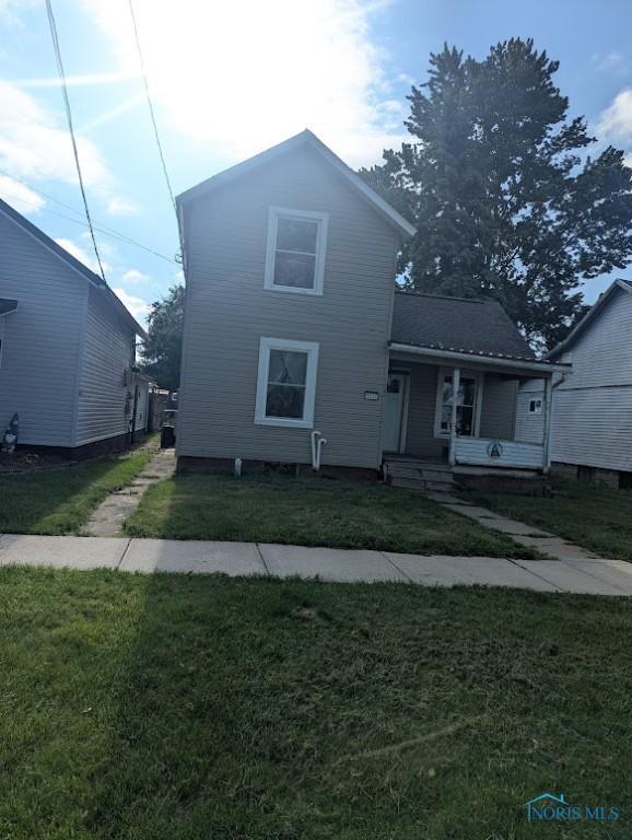 1022 Dodd St, Napoleon, OH 43545 - view of front of house with a front lawn