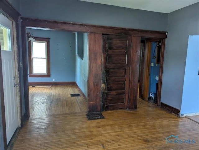 1022 Dodd St, Napoleon, OH 43545 - hallway with hardwood / wood-style flooring and baseboards