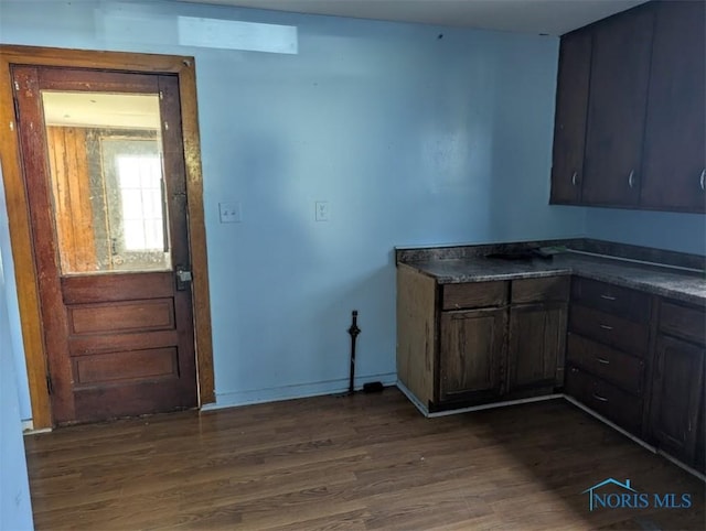 1022 Dodd St, Napoleon, OH 43545 - kitchen featuring dark wood-type flooring, dark countertops, and baseboards