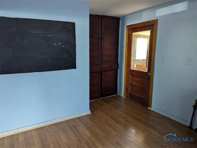 1022 Dodd St, Napoleon, OH 43545 - foyer entrance featuring wood finished floors and baseboards