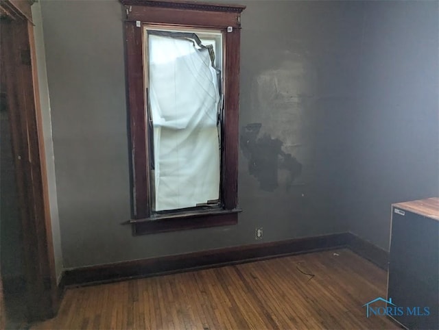 1022 Dodd St, Napoleon, OH 43545 - spare room featuring wood finished floors and baseboards