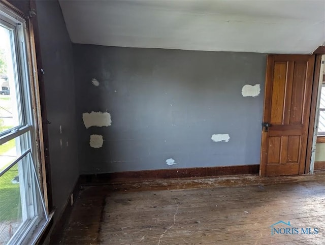 1022 Dodd St, Napoleon, OH 43545 - unfurnished room featuring hardwood / wood-style flooring, healthy amount of natural light, and baseboards