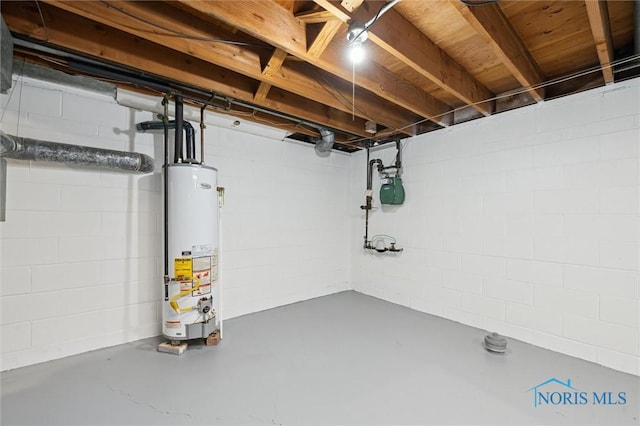 4801 Estero Pl, Toledo, OH 43623 - unfinished basement featuring water heater, gas meter, and concrete block wall