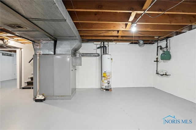 4801 Estero Pl, Toledo, OH 43623 - unfinished basement featuring gas water heater, gas meter, stairs, and heating unit