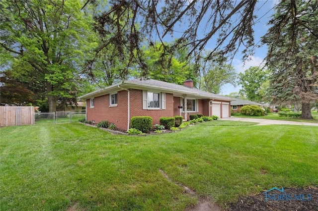 4801 Estero Pl, Toledo, OH 43623 - single story home with brick siding, an attached garage, a chimney, and driveway