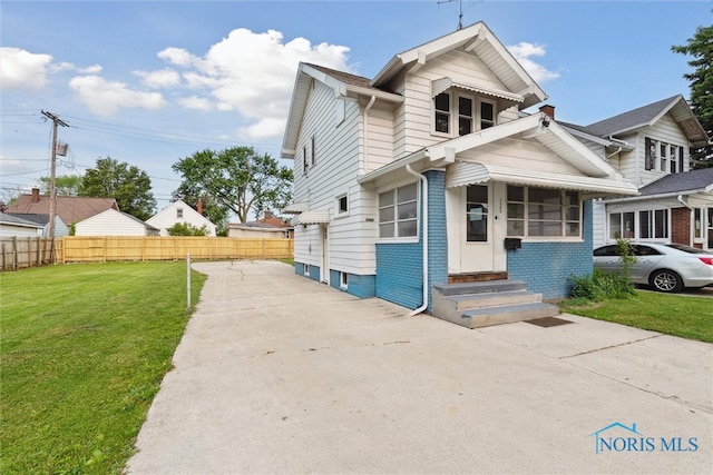 3409 Kirby Pl, Toledo, OH 43608 - view of front of house featuring entry steps, concrete driveway, and brick siding