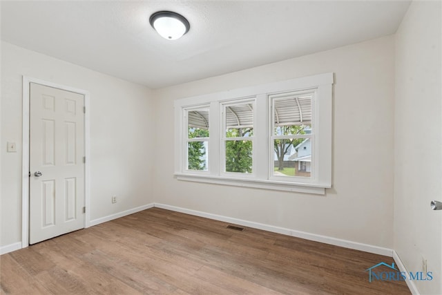 3409 Kirby Pl, Toledo, OH 43608 - empty room featuring baseboards and light wood-style floors
