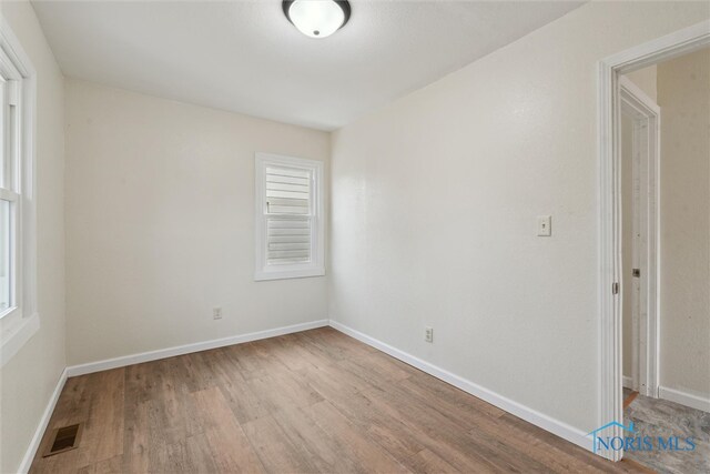3409 Kirby Pl, Toledo, OH 43608 - unfurnished room with wood finished floors and baseboards