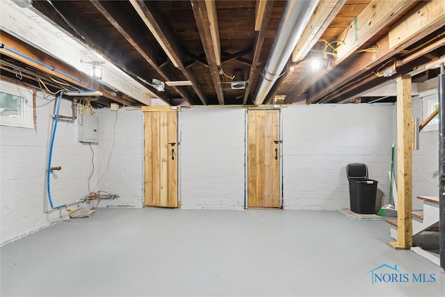 3409 Kirby Pl, Toledo, OH 43608 - unfinished basement with electric panel and stairway