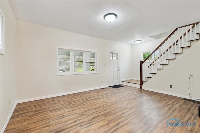 3409 Kirby Pl, Toledo, OH 43608 - foyer entrance with stairs and wood finished floors
