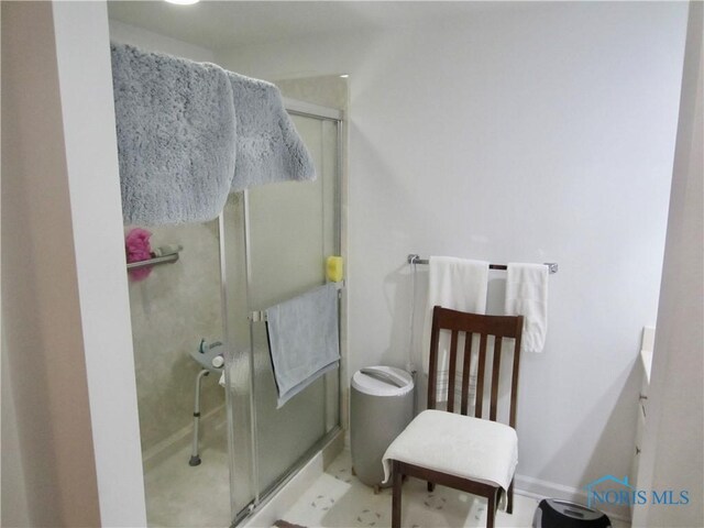 4343 W Bancroft St Unit 2D, Toledo, OH 43615 - bathroom featuring a stall shower, vanity, and baseboards