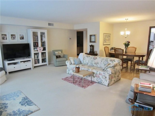 4343 W Bancroft St Unit 2D, Toledo, OH 43615 - living area featuring a chandelier and carpet floors